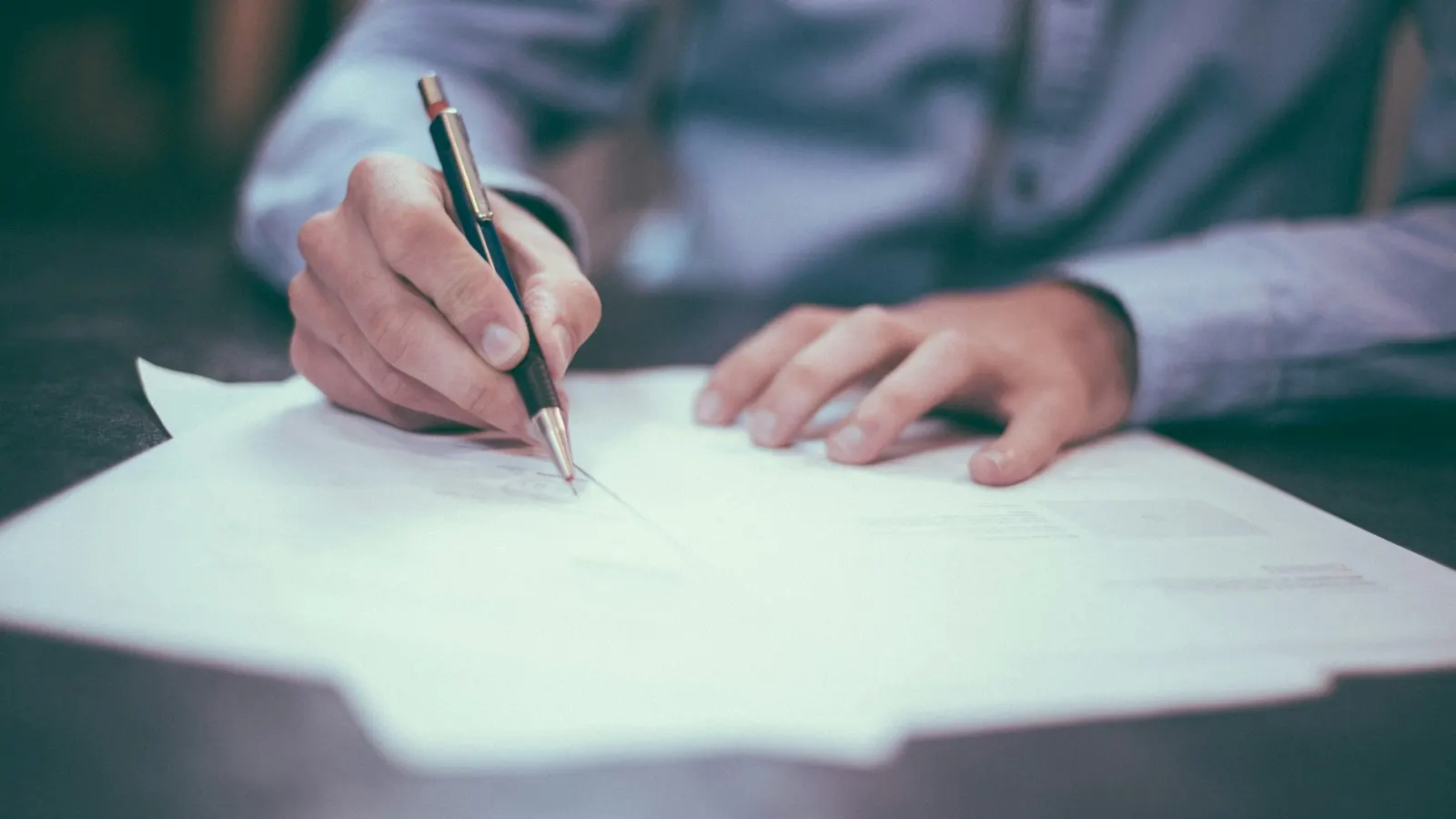 Attorney reviewing case files at a desk